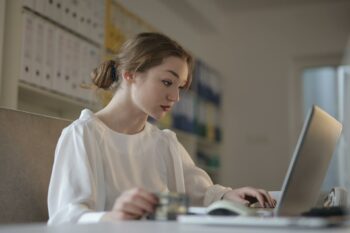 woman on laptop learning about bookkeeeping as a service