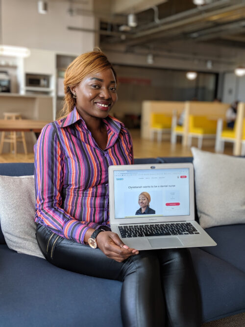 Christianah with launch campaign on laptop, Beam