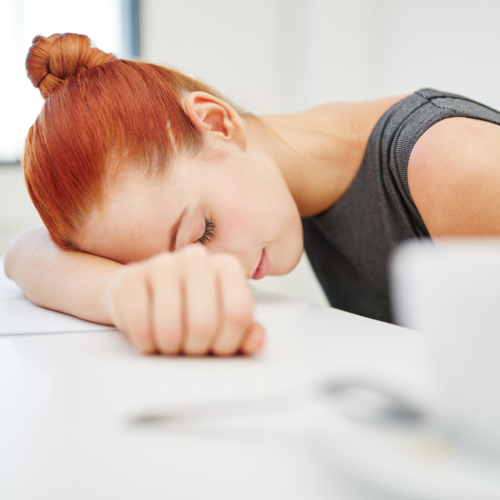 Woman with her head on the table