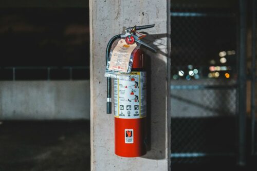 Fire extinguisher on wall in quick workplace checklist