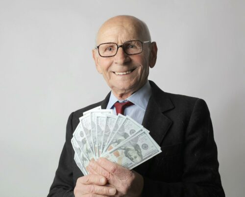 Man holding money to pay corporation tax for a limited company