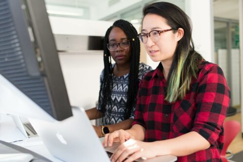 two women looking at business accounting services