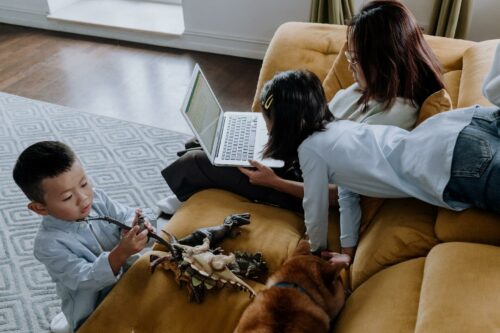 Woman working from home struggling to get a worklife balance with her kids distracting her.