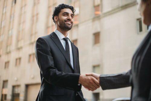 Tax accountant smiling wearing a suit