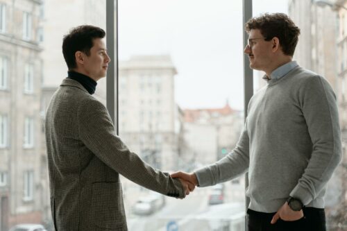 A business man and a tax accountant shaking hands