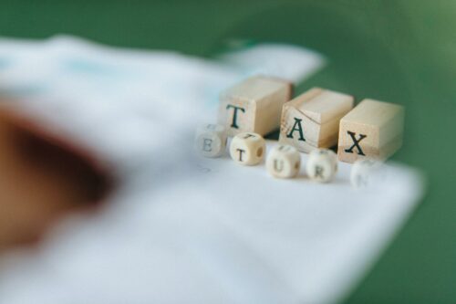 Blocks spelling out the word tax, as a reminder to complete your self assessment