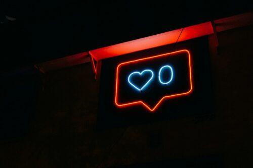neon sign of instagram like button, as social commerce becomes one of the best online marketplaces for 2023