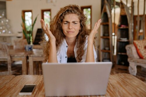Frustrated woman looking at financial ratios