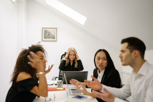 Team arguing after losing faith in company thanks to quiet firing